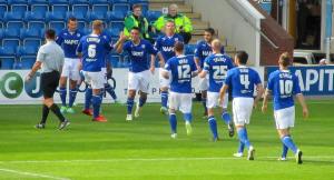 The players celebrate the first goal