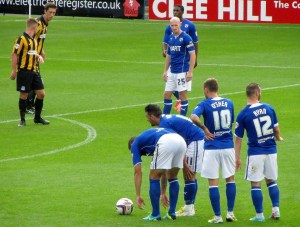 Chesterfield players stand over a free kick