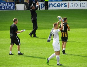 The Southend players applaud their fans