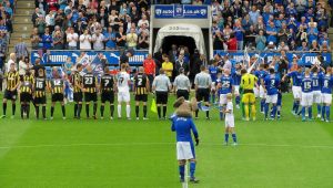 Line up on the pitch prior to kick off
