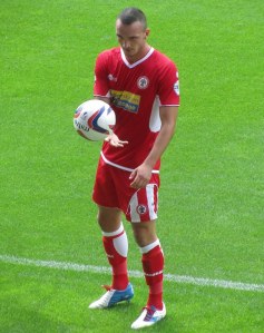 Tom Aldred retrieves the ball from the crowd