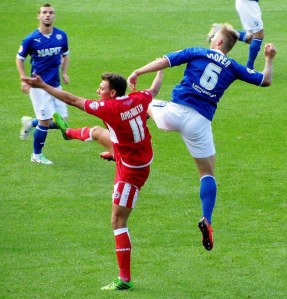 Cooper and Naismith battle for possession