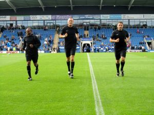 The officials warm up