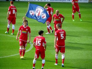 The Accrington players await kick off