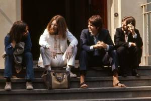 The Beatles again sat on the steps, this time in 1969