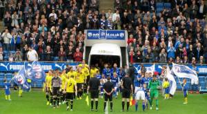 The players make their way on to the pitch