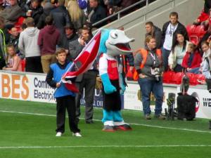 The Fleetwood mascot awaits the players