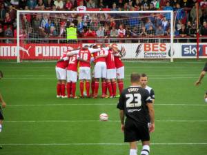 The Fleetwood players huddle up