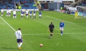 Ross Oulton takes a free kick for the Non-League side