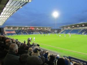 The floodlights shine over the stadium