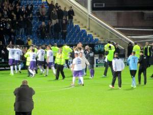The Daventry players applaud their travelling fans