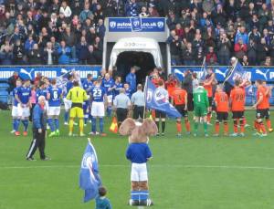 The players make their way on to the pitch