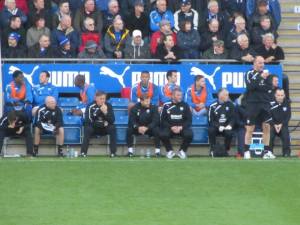 Paul Cook watches from the touchline
