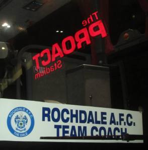 The reflection of the Proact sign in the window