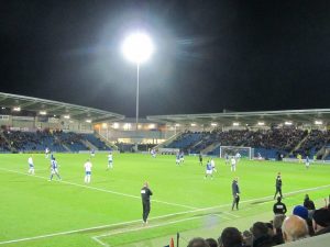 The two managers watch the match