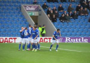 The players celebrate the opening goal