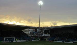 Floodlights shine over the stadium