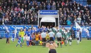 Players make their way on to the pitch