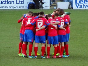 The Dagenham players huddle