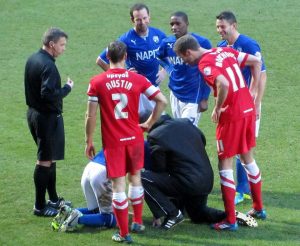 A Chesterfield player goes down injured