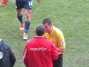 Andre Marriner has a word with an angry Nigel Clough
