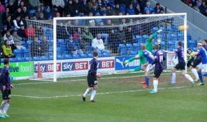 ...and forces an excellent diving save