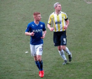 Aaron Downes marks Eoin Doyle