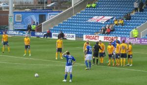 Gary Roberts stands over a free kick