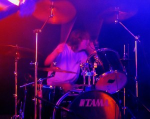 The drummer provides backing vocals