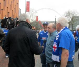 My Dad is interviewed outside the stadium