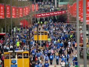 Fans make their way towards the stadium