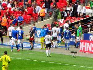 The players head to the dressing rooms