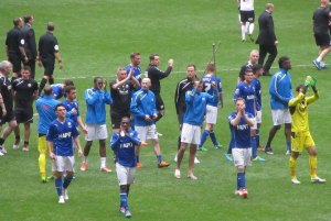 The Chesterfield players applaud the fans