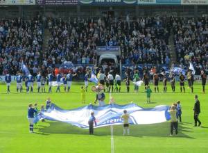 The players line up ahead of kick off