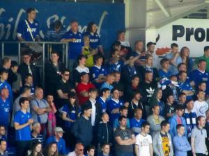 The fans in the Kop watch the match