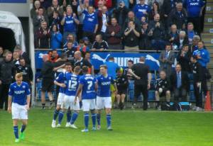 The players celebrate with Roberts