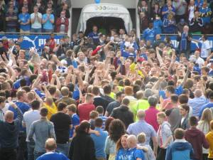 The fans cover the pitch