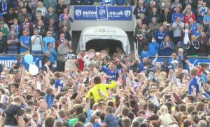 The players are hoisted on the shoulders of the supporters