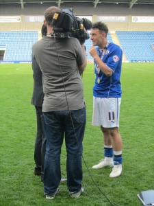 Roberts is interviewed on the pitch