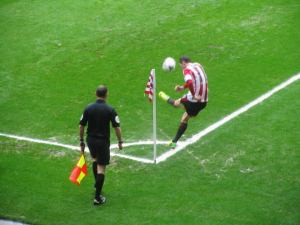 Adam Johnson takes a corner