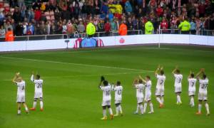 The Swansea players applaud their fans