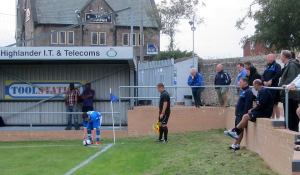 Paul Cook looks on as Hallam take a corner
