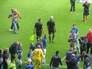 The players make their way on to the pitch