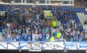 The away supporters cheer