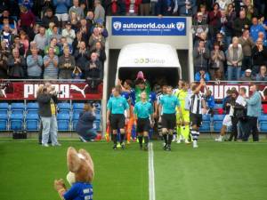 The players enter the field