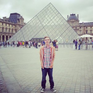 Stood in front of the Louvre Pyramid