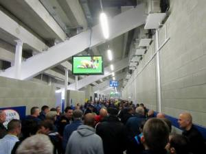 Fans watch the Leeds v Sheffield Wednesday match on TV before the game