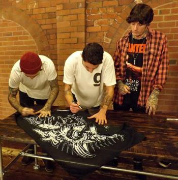 The band sign a flag